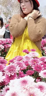 Woman in a bright floral field with pink flowers