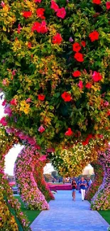 Vibrant garden archway with colorful flowers and lush greenery.