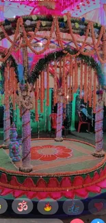 Vibrant Indian floral gazebo with colorful garlands.