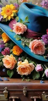 Blue hat with vibrant flowers and vintage suitcase.
