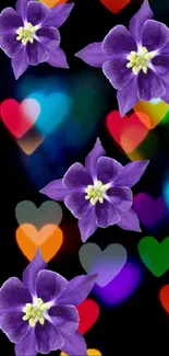 Purple flowers over colorful heart shapes in bokeh style on a black background.