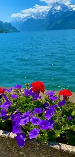 Vibrant lake scene with colorful flowers and mountains.