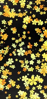 Vibrant floral wallpaper with orange and yellow flowers on a black background.