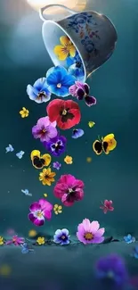 Cup pouring colorful flowers on teal background.