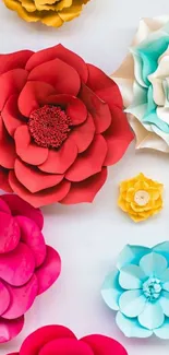 Vibrant paper flower art wallpaper in red, blue, and yellow hues.