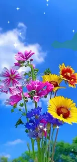 Colorful flowers against a bright blue sky with a cloud.