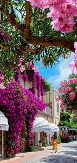 Vibrant street with pink and purple flowers cascading over buildings.