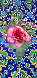 Pink rose on vibrant blue tile background.