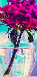 Vibrant magenta flowers in a clear vase against a blue gradient background.