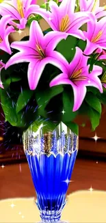 A vibrant bouquet of pink lilies in a blue vase adds elegance to your wallpaper.