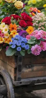 Colorful assortment of flowers in a wooden cart.