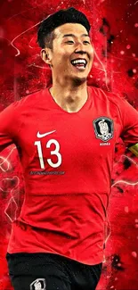 A football player celebrating in vibrant red tones, on a dynamic mobile wallpaper.