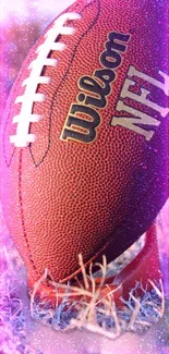 Vibrant NFL football on a field with purple and pink glowing effects.