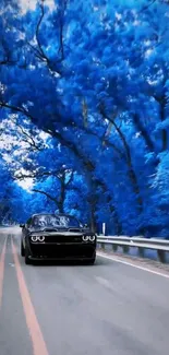 Sleek car driving through a forest with vibrant blue trees on a road.