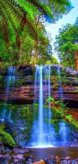 Vibrant forest waterfall with lush greenery.