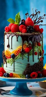 Artistic cake with chocolate drips and berries on a blue background.