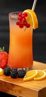 Vibrant fruit juice with orange slices and berries on wooden surface.