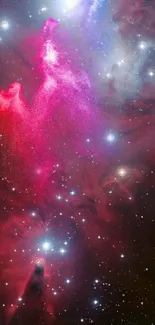 Colorful galactic nebula wallpaper with vibrant red and purple hues and bright stars.