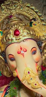 Vibrant Ganesh with golden decorations, ideal for phone wallpaper.