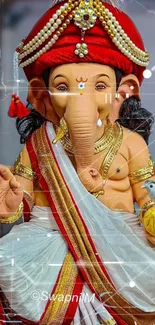 Colorful Ganesh statue with red turban and spiritual design.