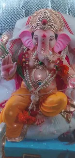 Vibrant Ganesha idol adorned in a decorative shrine.