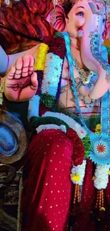 Vibrant Ganesha idol adorned with colorful garlands.