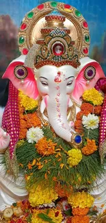 Vibrant Ganesha idol with colorful floral decorations.