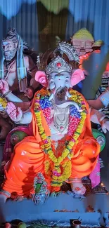 Colorful Ganesh idol with vibrant decorations.