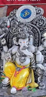 Intricate Ganesha statue on vibrant wallpaper background.