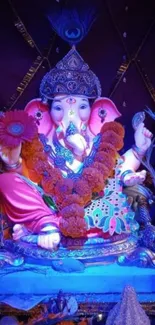 Colorful Ganesha idol with vibrant background.