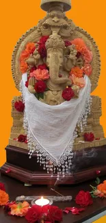 Mobile wallpaper featuring a golden Ganesha adorned with colorful flowers.