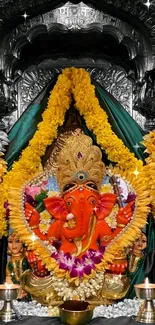 Vibrant Lord Ganesha Idol with floral garlands and rich colors.