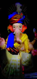 Vibrant Ganesha statue with golden glow.