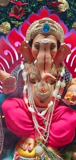 Colorful Ganesha idol with festive decorations and sweets.