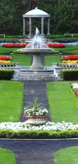 Colorful garden with fountain and vibrant flowers.