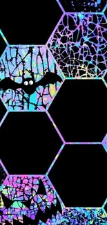 Colorful geometric wallpaper with bat and abstract patterns for Halloween.