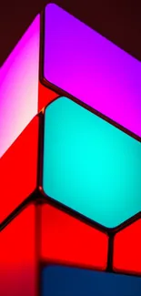 Vibrant geometric shapes with purple, red, and teal on a mobile wallpaper.