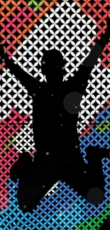 Silhouette jumping with geometric colorful background.