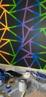 Colorful geometric wall art with vibrant triangles on a black background.