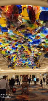 Colorful and intricate glass ceiling with vivid patterns in a luxury setting.