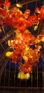 Stunning glass floral display with vibrant orange and yellow hues.