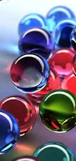 Colorful glass orbs on a reflective surface wallpaper.