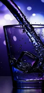 Purple glass with liquid splash and bokeh background.