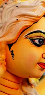 Detailed goddess statue with vibrant colors in artistic wallpaper.