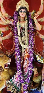 Goddess Durga idol surrounded by vibrant colors and intricate details.