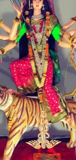 Goddess Durga idol with vibrant attire and tiger.