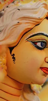 Close-up of a colorful goddess statue with intricate details.