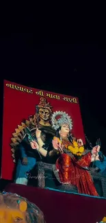 Colorful mural depicting a Hindu goddess on vibrant wallpaper.