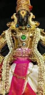 Vibrant gold deity with intricate details and vibrant attire.