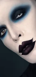 Striking gothic makeup with blue eyeshadow and dark lips.